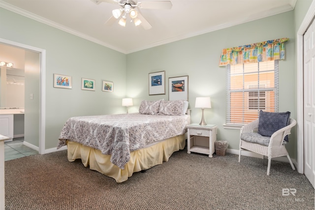 carpeted bedroom featuring crown molding, ensuite bath, and ceiling fan