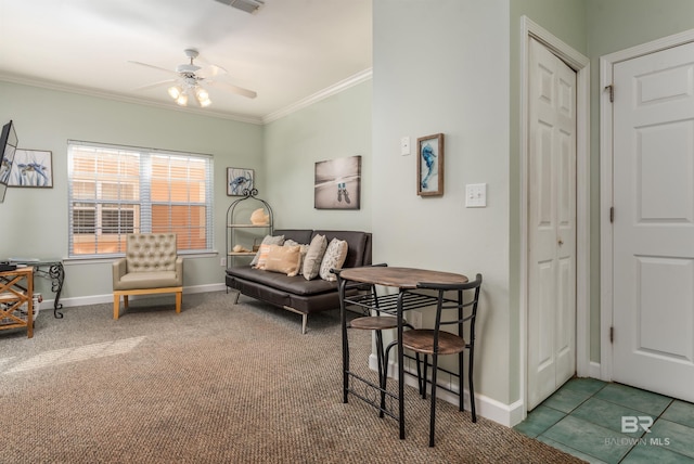 carpeted living room featuring ceiling fan and ornamental molding