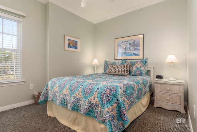 carpeted bedroom with ceiling fan and crown molding