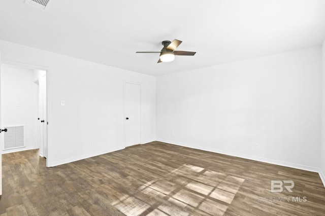 unfurnished room with ceiling fan and dark hardwood / wood-style floors