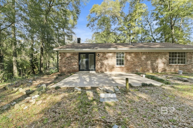 rear view of property featuring a patio area