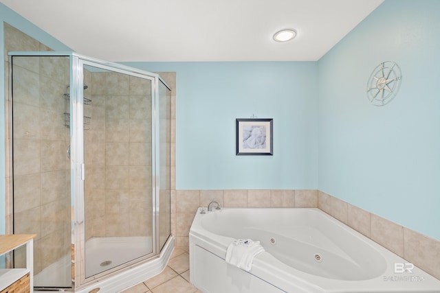 bathroom with separate shower and tub and tile patterned floors