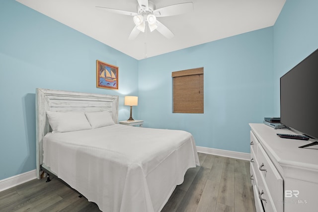 bedroom with wood-type flooring and ceiling fan