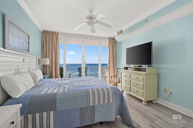 bedroom with crown molding, ceiling fan, access to outside, light wood-type flooring, and floor to ceiling windows