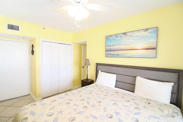 unfurnished bedroom with a closet, ceiling fan, and light tile patterned floors