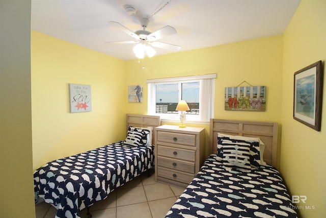 tiled bedroom with ceiling fan