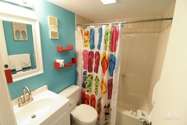 full bathroom featuring shower / bath combo with shower curtain, vanity, and toilet