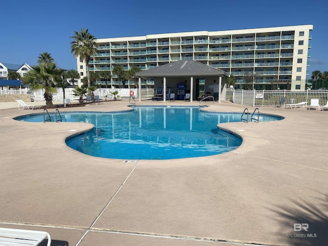 view of swimming pool featuring a patio area