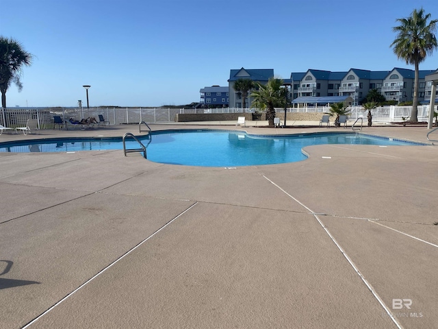 view of swimming pool with a patio area