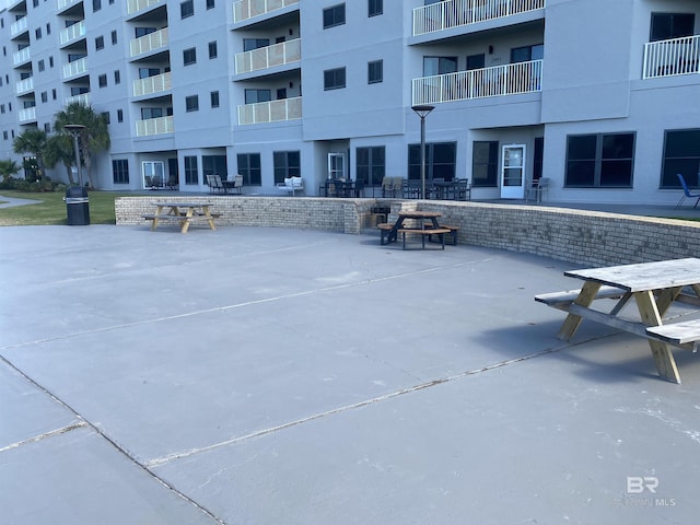 view of property's community featuring a patio area