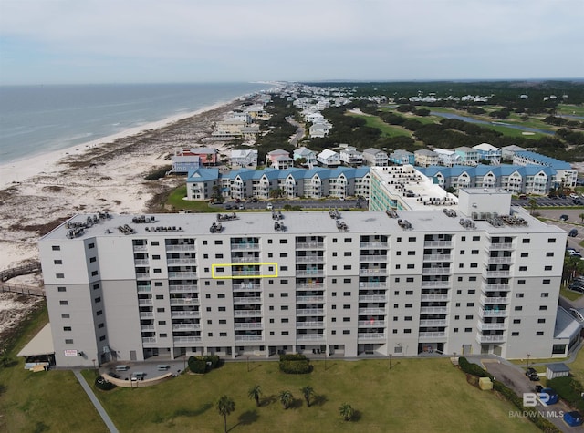 aerial view featuring a view of the beach and a water view