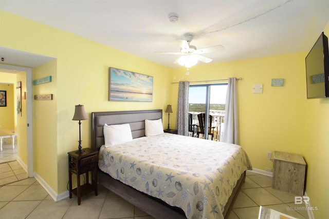 bedroom with ceiling fan, light tile patterned floors, and access to exterior