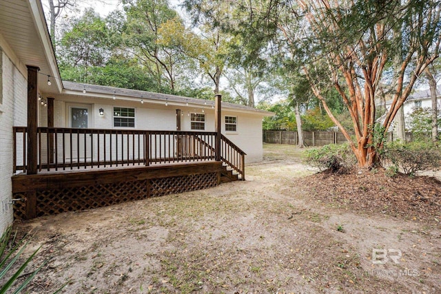 back of property featuring a deck