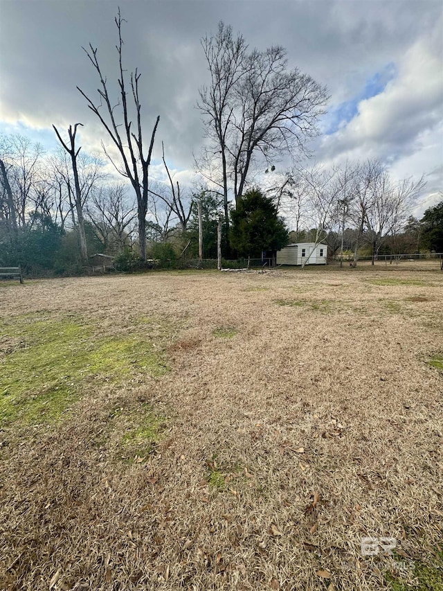 view of yard with a rural view