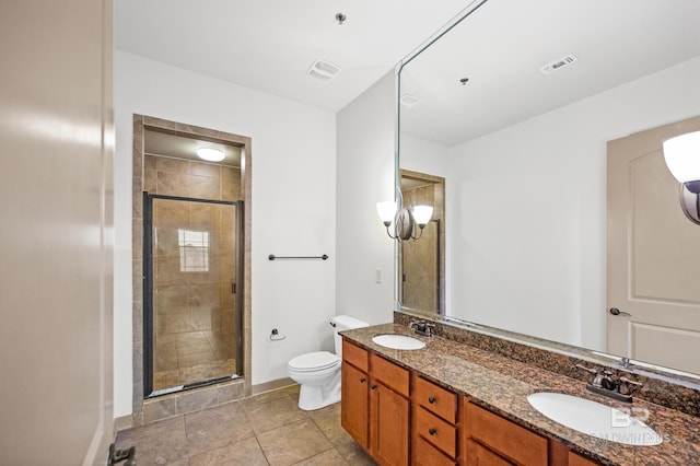 bathroom with oversized vanity, toilet, tile flooring, walk in shower, and double sink