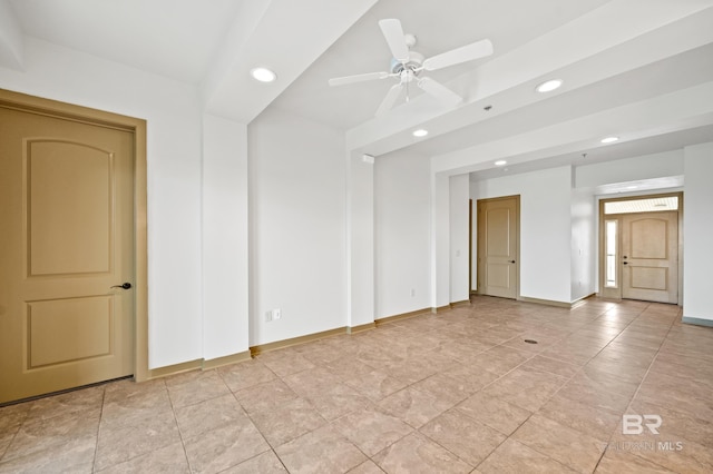 unfurnished room featuring ceiling fan and light tile floors