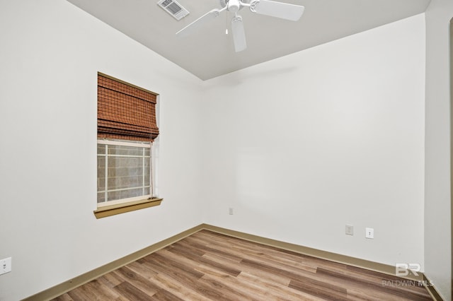 spare room with wood-type flooring and ceiling fan