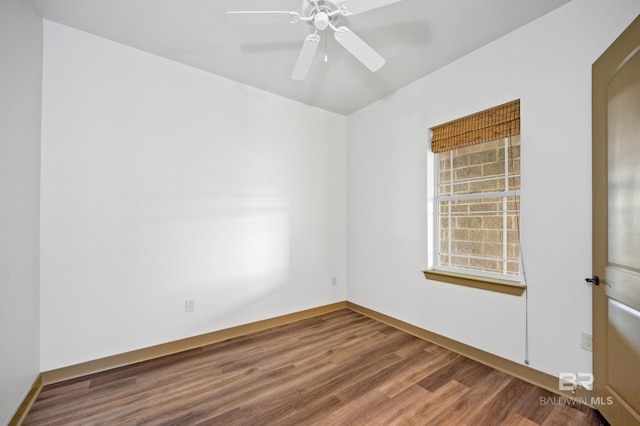 unfurnished room with hardwood / wood-style floors and ceiling fan