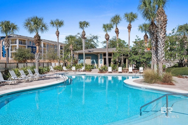 view of swimming pool with a patio