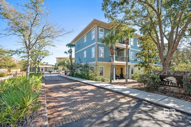 view of front of house with a balcony