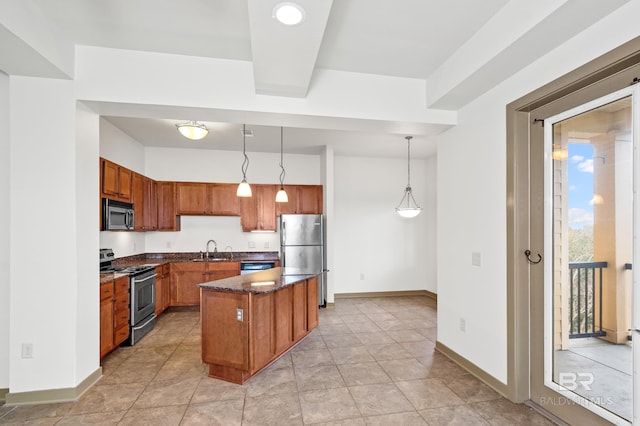 kitchen featuring a center island, hanging light fixtures, appliances with stainless steel finishes, sink, and light tile floors