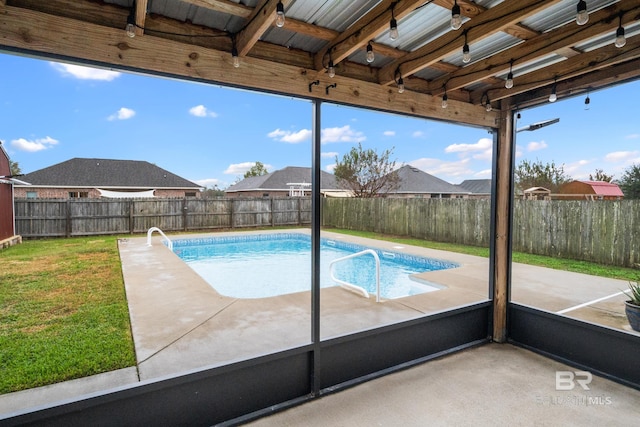 view of swimming pool with a lawn and a patio area