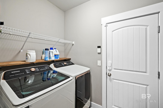 laundry room with washing machine and dryer