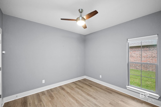 spare room featuring ceiling fan and light wood-type flooring