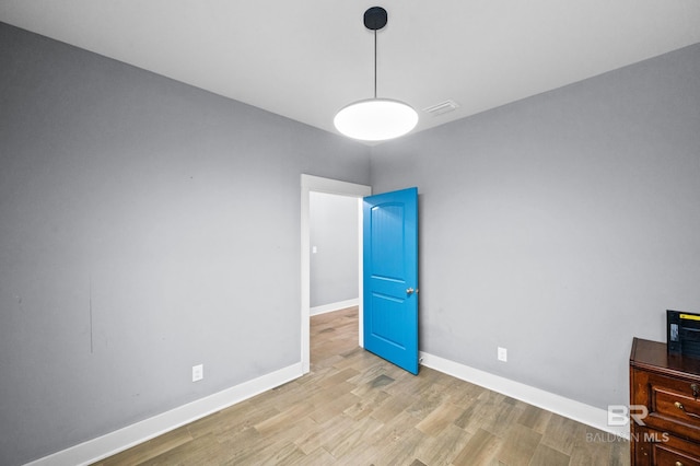 unfurnished bedroom featuring light hardwood / wood-style floors