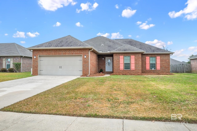 ranch-style home featuring a garage and a front yard