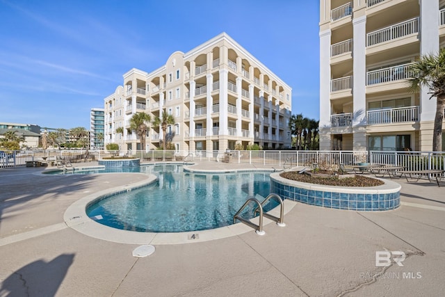 view of swimming pool with a patio