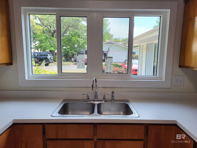 kitchen with a sink and light countertops