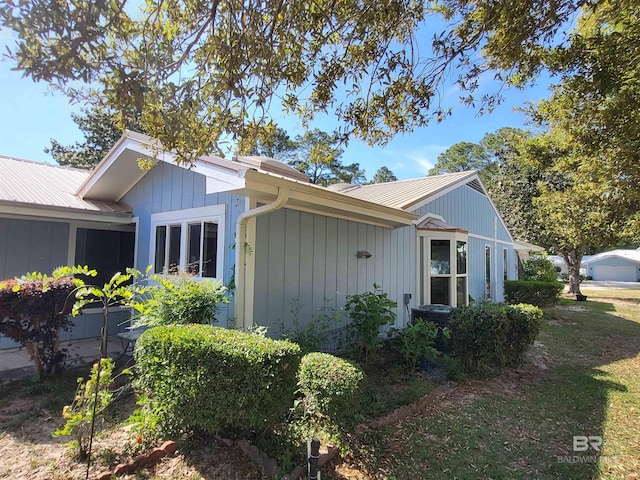 view of home's exterior with metal roof