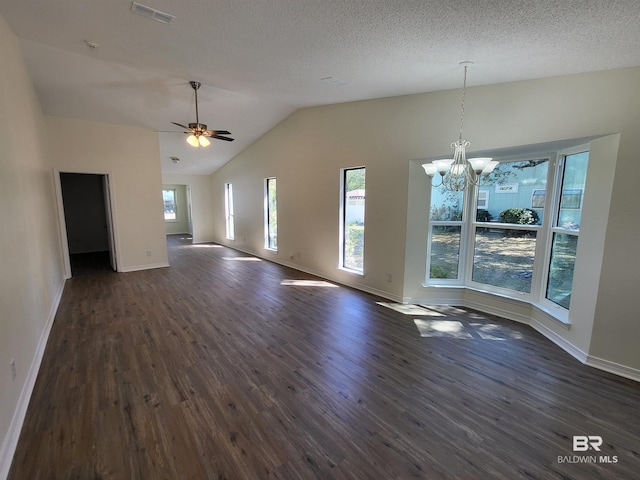 unfurnished living room with dark wood-style floors, lofted ceiling, baseboards, a chandelier, and ceiling fan