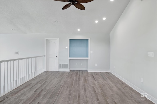 unfurnished living room with ceiling fan and light hardwood / wood-style floors