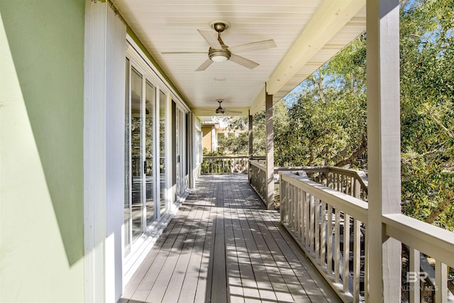 wooden deck featuring ceiling fan