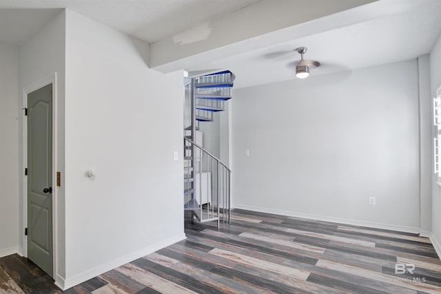 empty room with dark hardwood / wood-style flooring