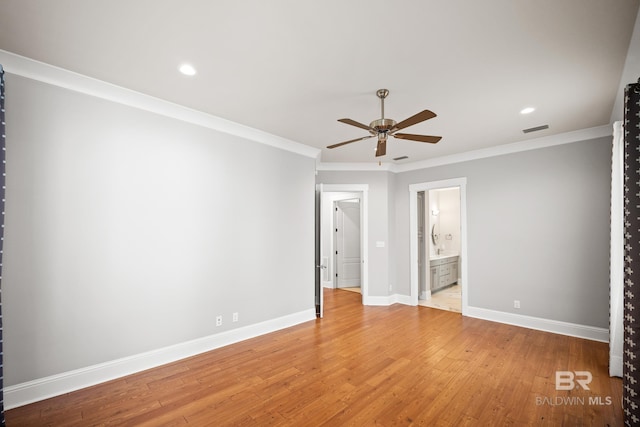 467 Colony Dr, Fairhope, AL 36532 - unfurnished bedroom featuring baseboards, crown molding, light wood-style floors, recessed lighting, and ceiling fan