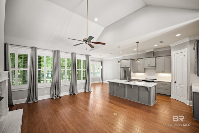 467 Colony Dr, Fairhope, AL 36532 - kitchen featuring gray cabinets, vaulted ceiling, ceiling fan, light countertops, and a sink