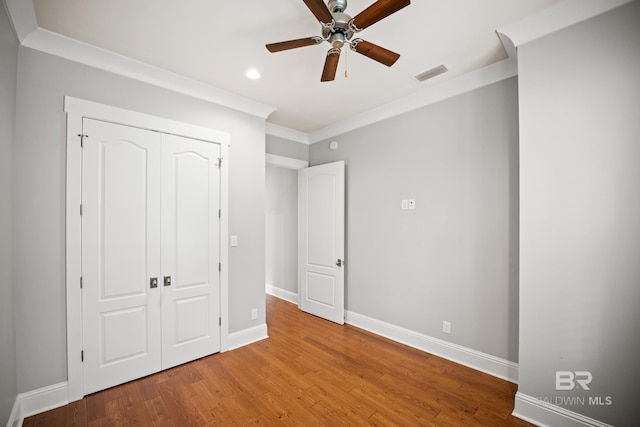 467 Colony Dr, Fairhope, AL 36532 - unfurnished bedroom featuring wood finished floors, baseboards, recessed lighting, a closet, and ornamental molding