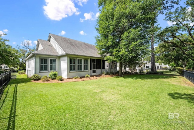 467 Colony Dr, Fairhope, AL 36532 - rear view of house with roof with shingles and a sunroom