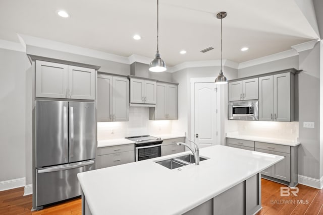 467 Colony Dr, Fairhope, AL 36532 - kitchen with appliances with stainless steel finishes, gray cabinetry, a sink, backsplash, and ornamental molding