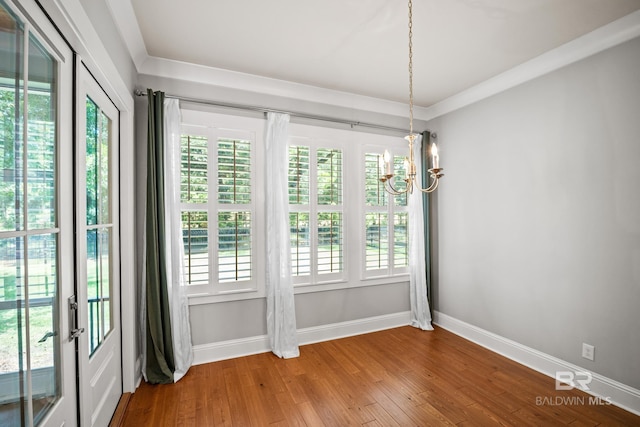 467 Colony Dr, Fairhope, AL 36532 - unfurnished dining area with a chandelier, baseboards, and wood finished floors