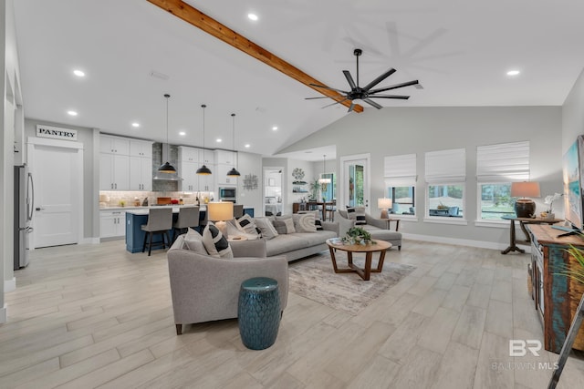 living area featuring recessed lighting, a ceiling fan, light wood finished floors, and beam ceiling
