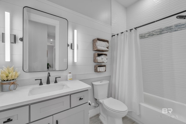 full bath featuring vanity, shower / tub combo with curtain, and toilet