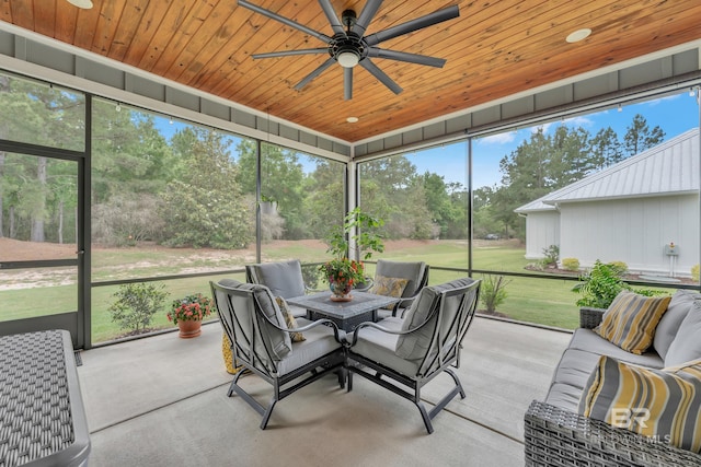 sunroom / solarium with ceiling fan, a wealth of natural light, and outdoor lounge area