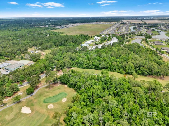 birds eye view of property with a water view and view of golf course