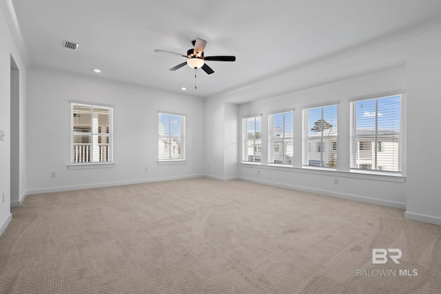 unfurnished room with recessed lighting, visible vents, baseboards, and light carpet