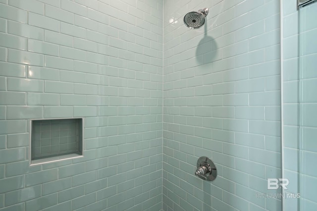 full bath featuring a tile shower