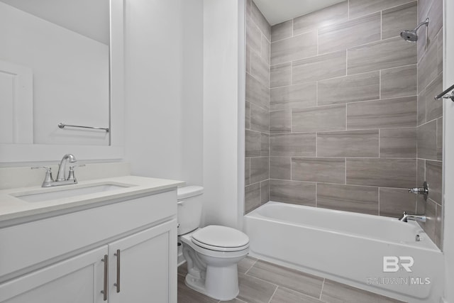 full bath featuring vanity, toilet, and washtub / shower combination